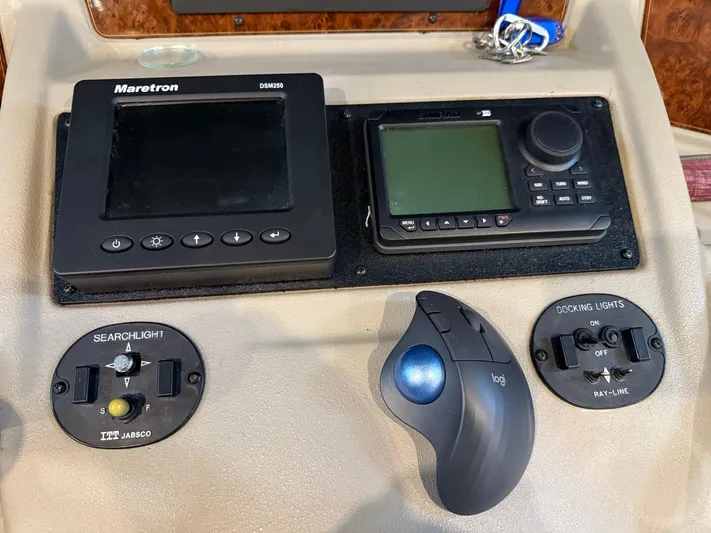 The Office Yacht Photos Pics Control panel of a 2001 Bayliner 5288 Pilot House Motoryacht with navigation and lighting controls.