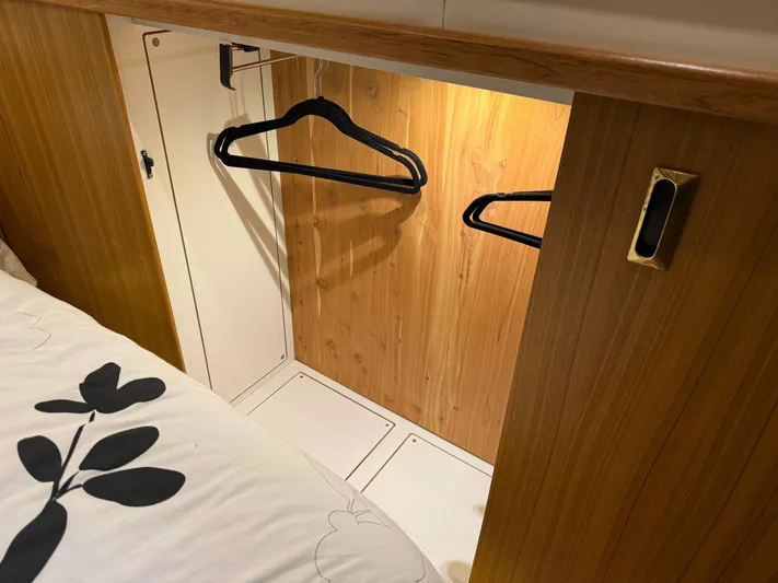 The Office Yacht Photos Pics Wooden closet with hangers inside a 2001 Bayliner 5288 Pilot House Motoryacht.