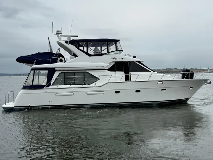The Office Yacht Photos Pics 2001 Bayliner 5288 Pilot House Motoryacht cruising on calm waters.