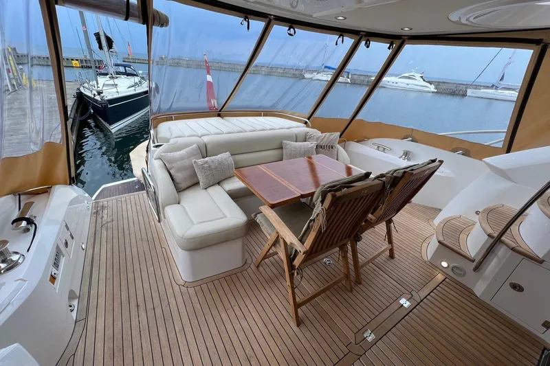  Yacht Photos Pics Luxurious 2012 Sunseeker Manhattan 53 yacht interior with elegant seating and dining area.