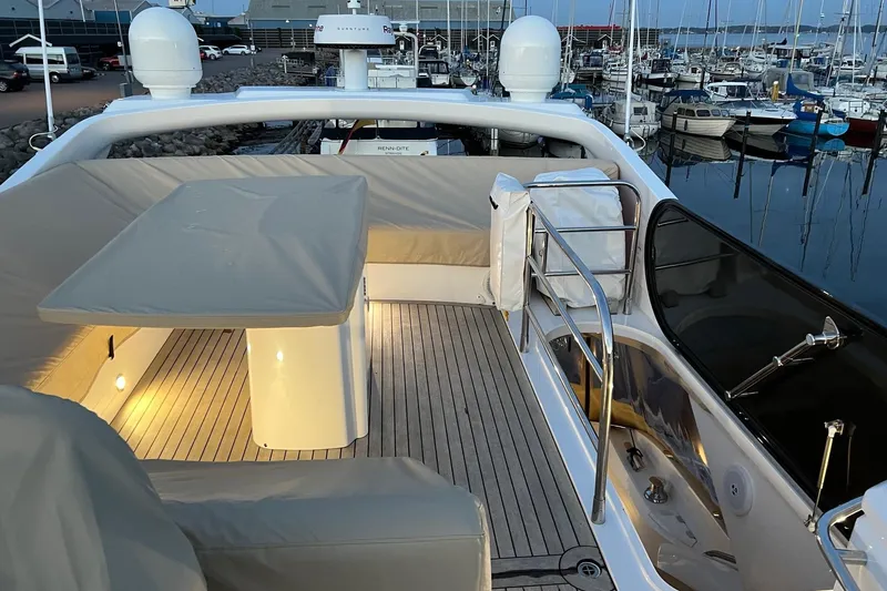  Yacht Photos Pics Luxurious 2012 Sunseeker Manhattan 53 yacht deck with seating and marina view.