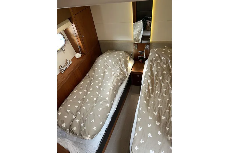  Yacht Photos Pics Twin beds in 2012 Sunseeker Manhattan 53 yacht cabin with patterned bedding.