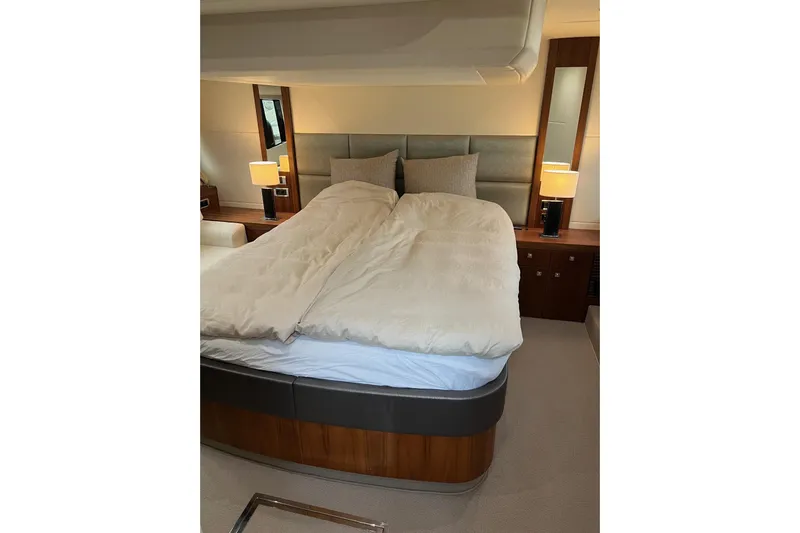  Yacht Photos Pics Luxurious bedroom interior of 2012 Sunseeker Manhattan 53 yacht with elegant bedding.