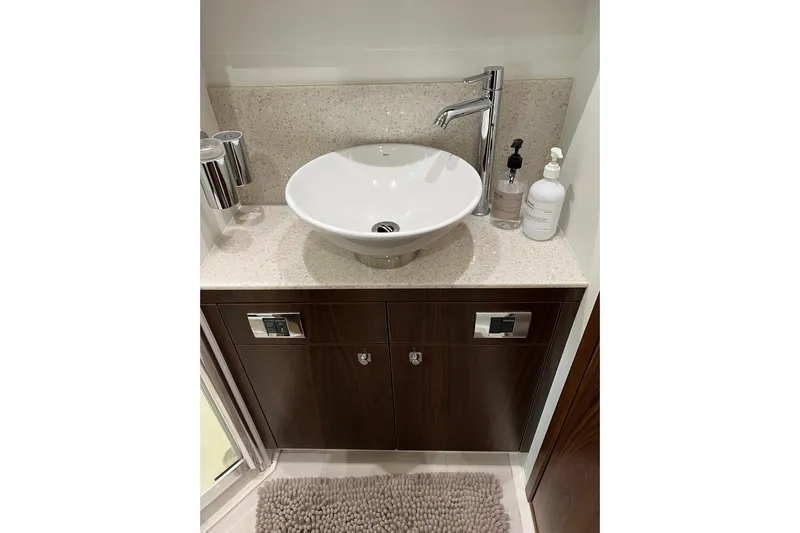  Yacht Photos Pics Luxurious bathroom sink in 2012 Sunseeker Manhattan 53 yacht, featuring modern fixtures.