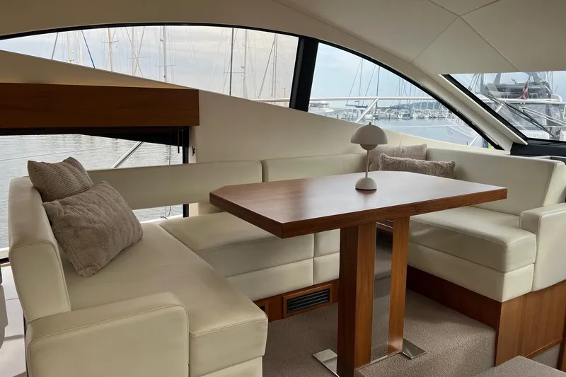  Yacht Photos Pics Luxurious interior of 2012 Sunseeker Manhattan 53 yacht with elegant seating and table.