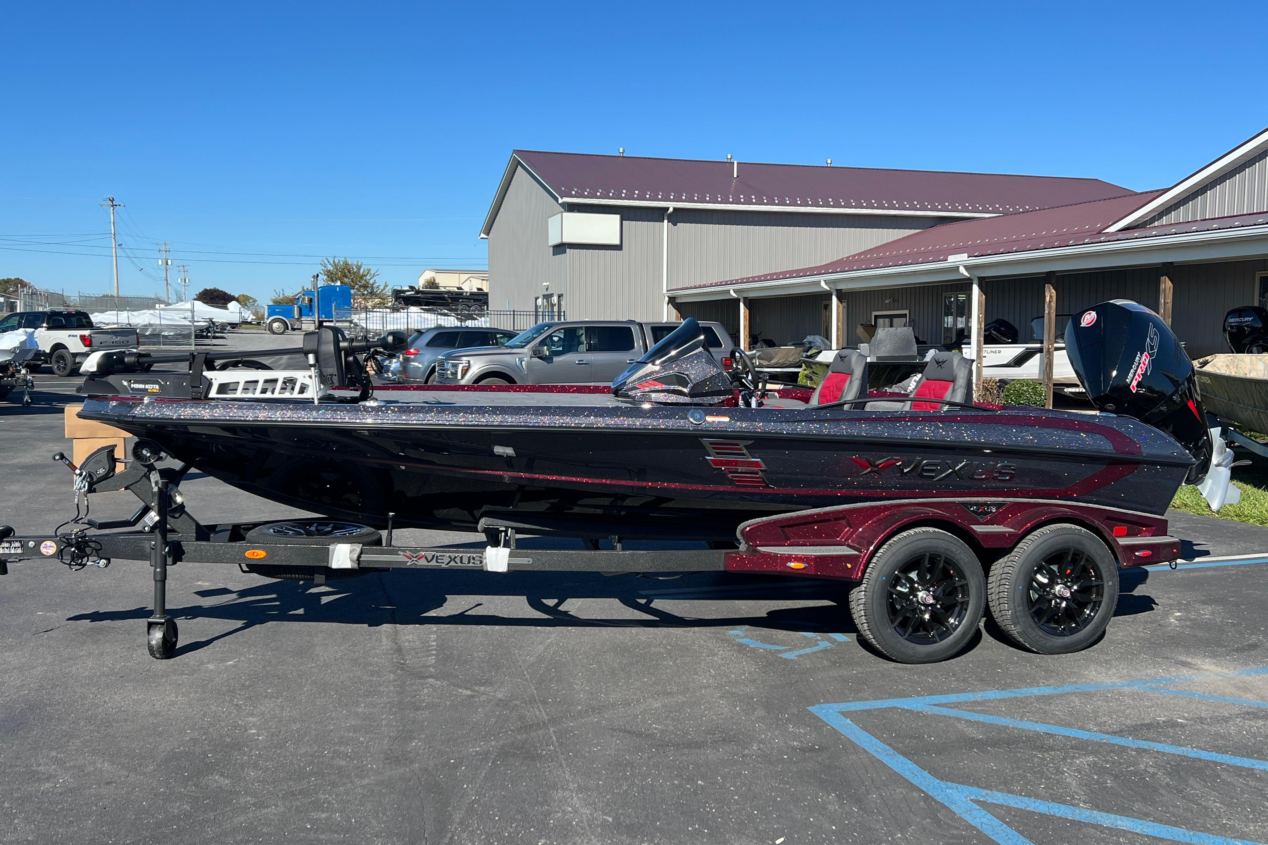 2026 Vexus VXS20 boat on trailer, parked outdoors under clear blue sky.