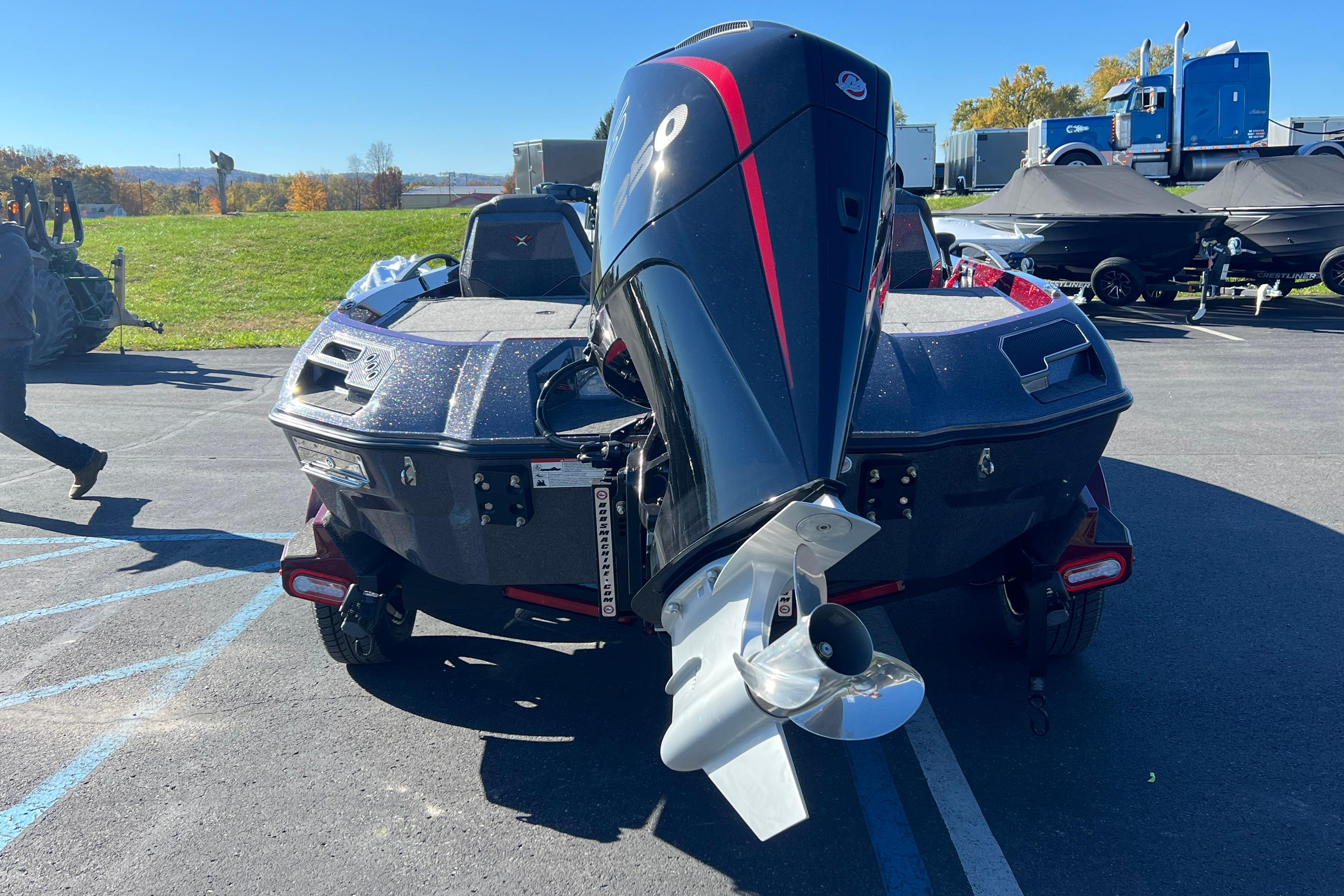 2026 Vexus VXS20 boat with powerful outboard motor in a parking lot.
