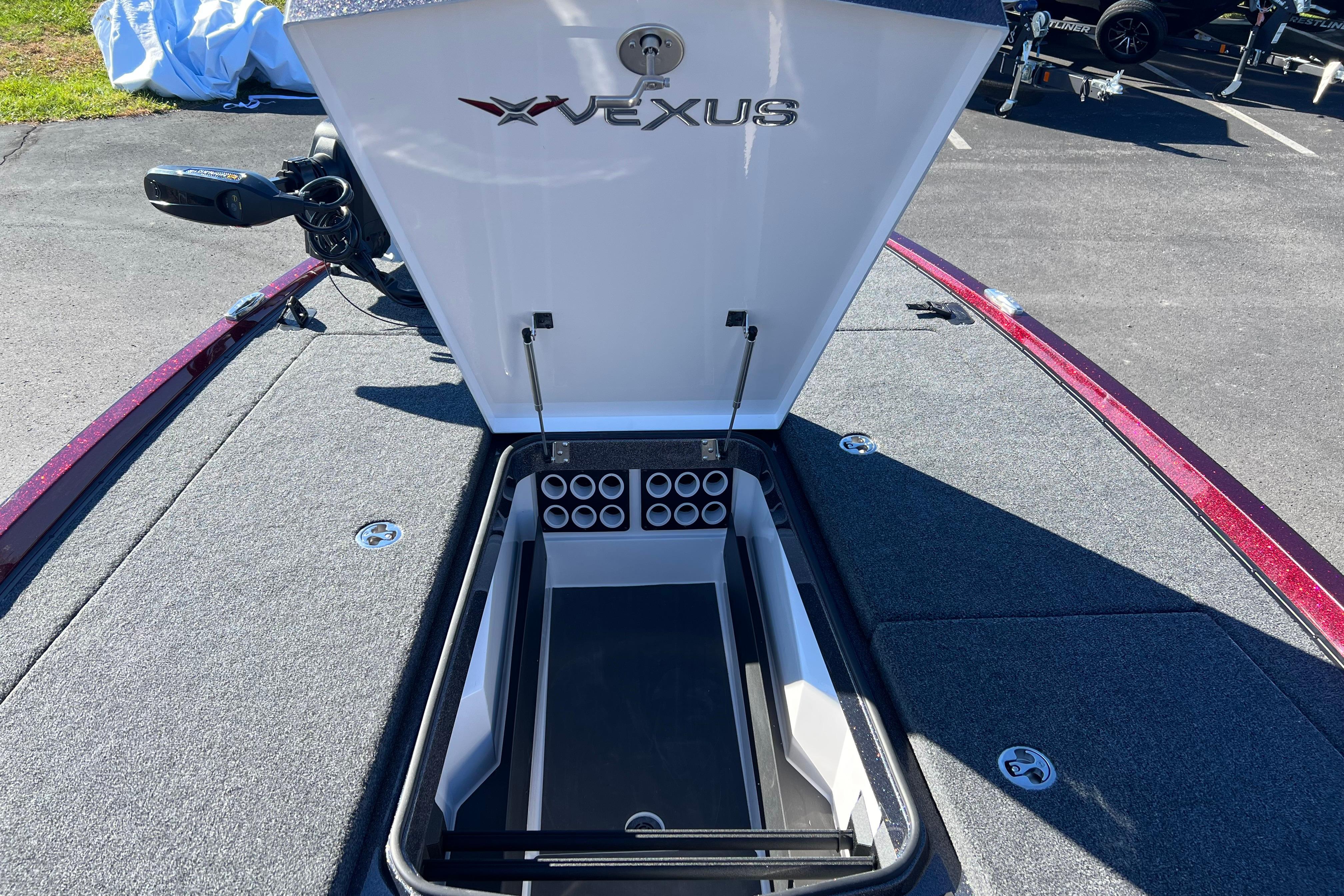 Open storage compartment on 2026 Vexus VXS20 boat, showcasing organized interior layout.