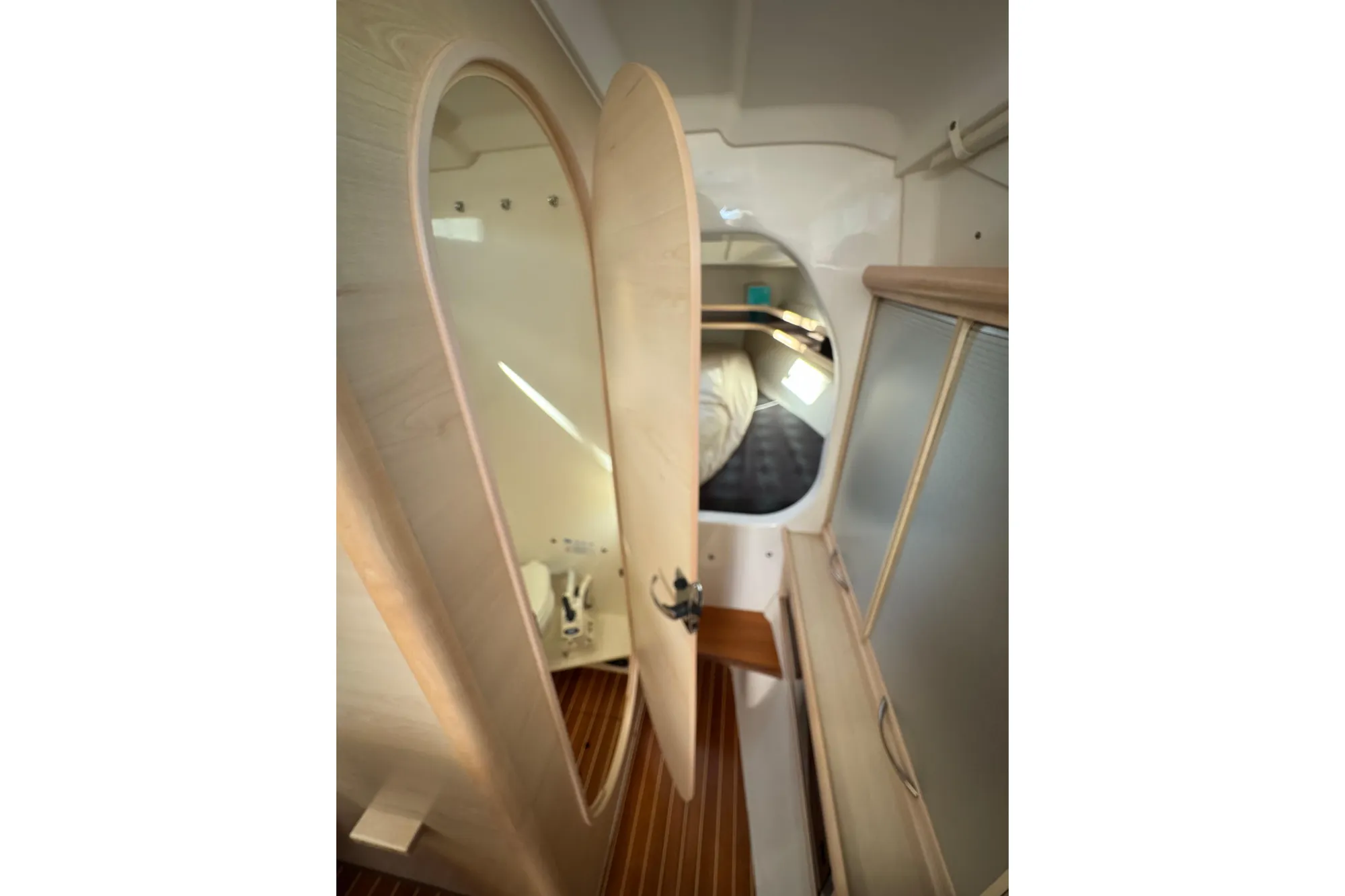 Interior of a 2016 Dragonfly 32 yacht with wooden doors and mirror.