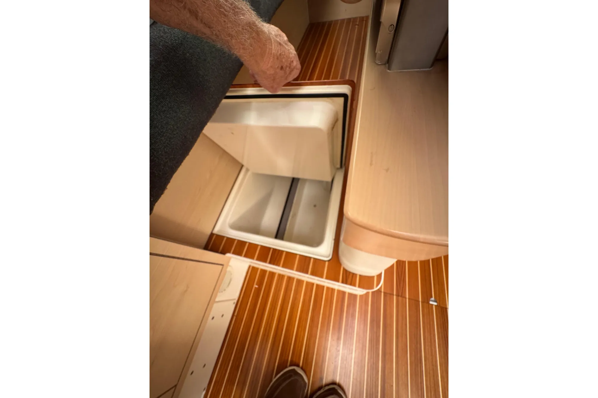 Interior view of 2016 Dragonfly 32 sailboat with open storage compartment.