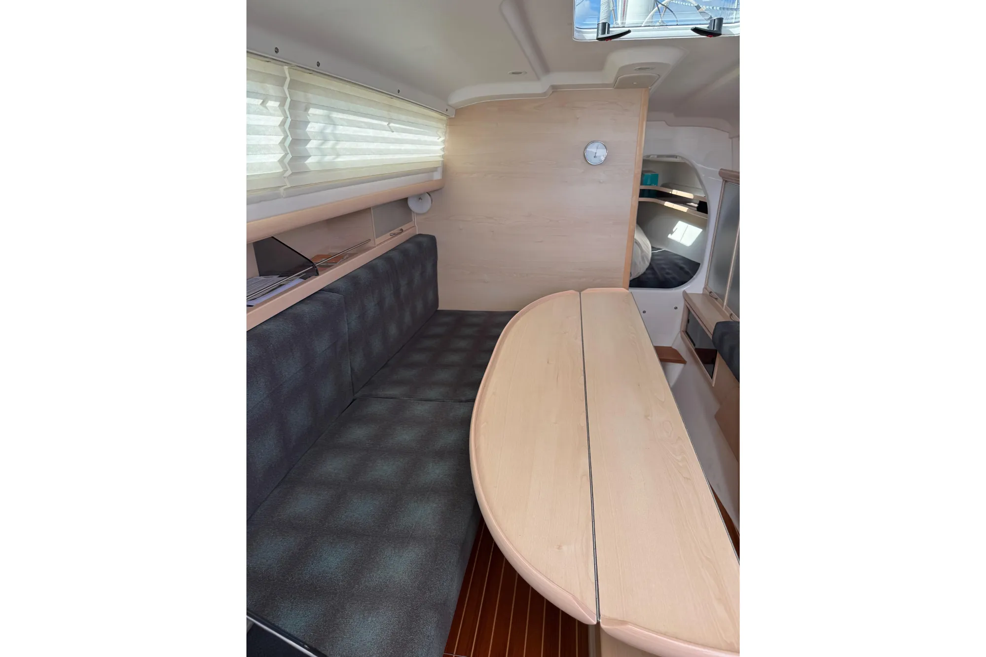 Interior of 2016 Dragonfly 32 sailboat with seating and table, featuring modern design.