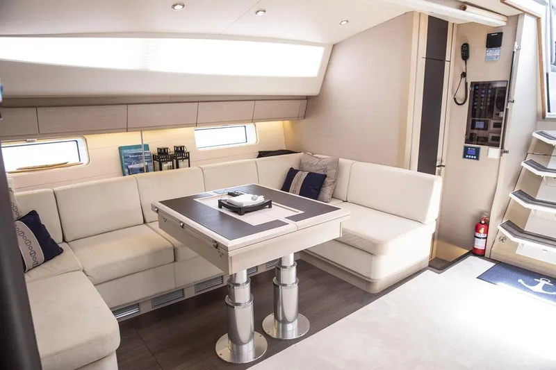  Yacht Photos Pics Luxurious interior of 2020 Jeanneau 64 yacht with elegant seating and modern design.
