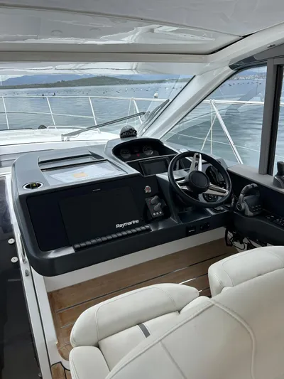  Yacht Photos Pics Helm of 2021 Princess V50 Open yacht with modern navigation system.