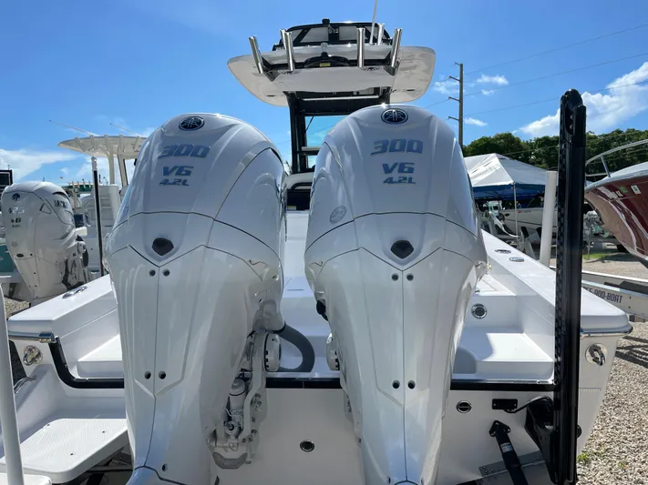 #339 White Yacht Photos Pics 2023 Everglades 273CC boat with dual 300 V6 engines, rear view.