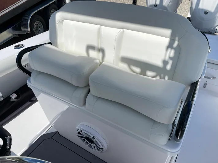 #339 White Yacht Photos Pics 2023 Everglades 273CC boat seating with white cushions and speaker.