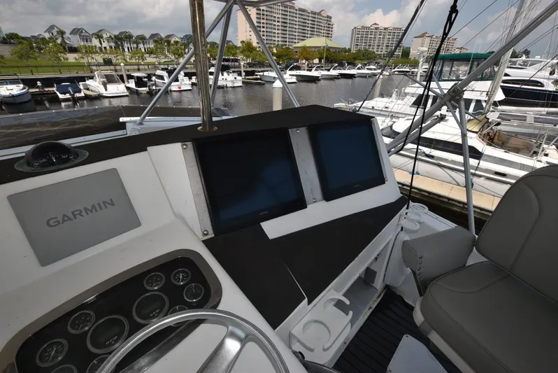 For Reel Yacht Photos Pics Cockpit of 1997 Viking 50 Convertible yacht with Garmin navigation system at marina.