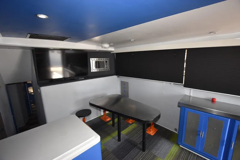 For Reel Yacht Photos Pics Interior of a 1997 Viking 50 Convertible yacht with modern seating and cabinetry.