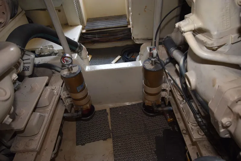 For Reel Yacht Photos Pics Engine room of a 1997 Viking 50 Convertible yacht, showcasing mechanical components.