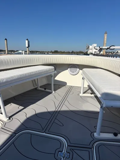  Yacht Photos Pics Interior view of a 2019 Egret 290 boat with seating benches.
