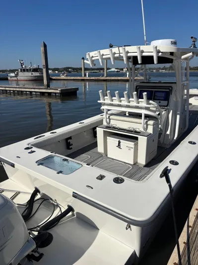  Yacht Photos Pics Egret 290 boat from 2019 docked at harbor, clear sky.