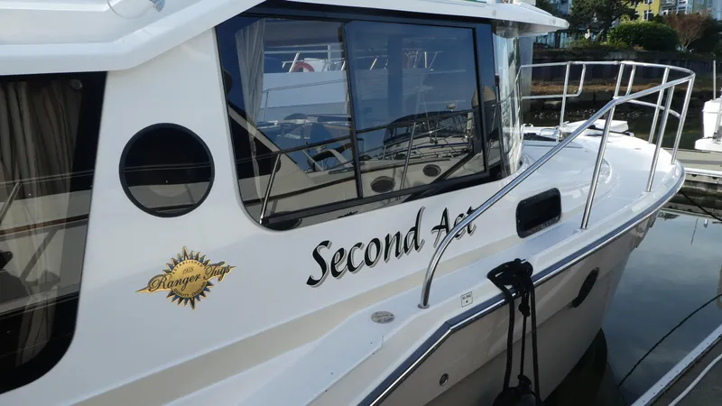 Second Act Yacht Photos Pics 2021 Ranger Tugs R-29 S boat named "Second Act" docked at a marina.