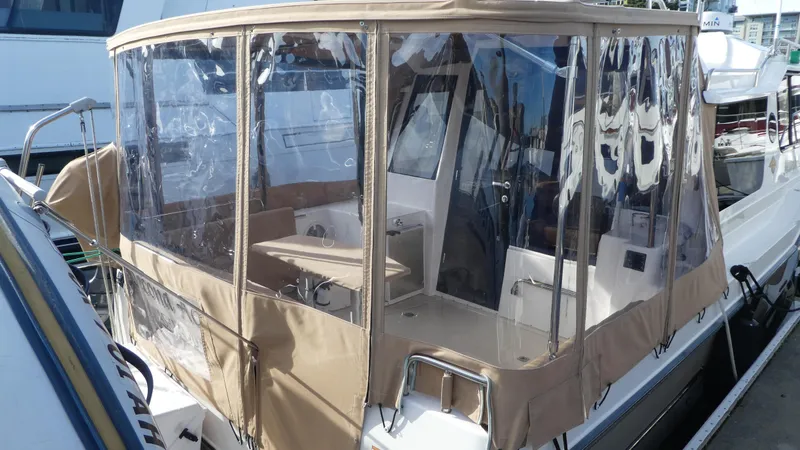 Second Act Yacht Photos Pics 2021 Ranger Tugs R-29 S with enclosed cockpit, docked at marina.