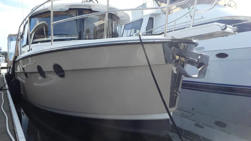 Second Act Yacht Photos Pics 2021 Ranger Tugs R-29 S boat docked at marina, side view.