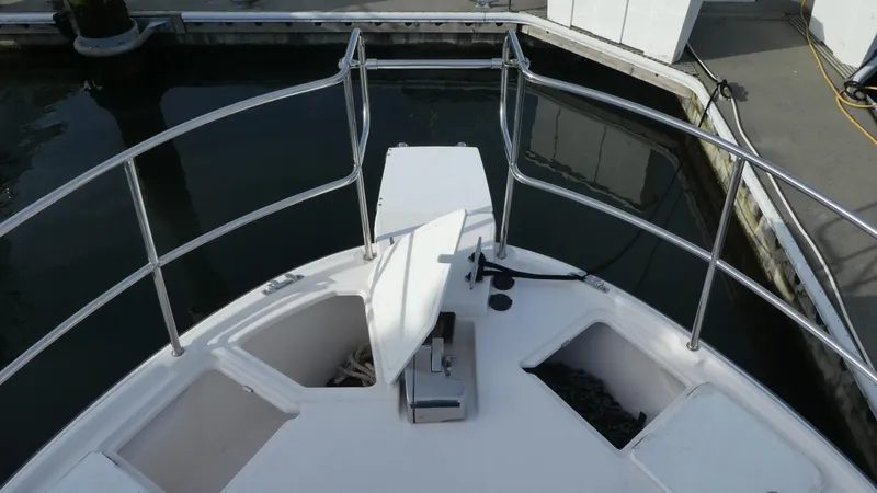 Second Act Yacht Photos Pics Bow view of 2021 Ranger Tugs R-29 S at dock, featuring railings and anchor storage.