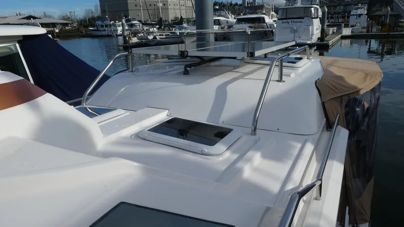 Second Act Yacht Photos Pics 2021 Ranger Tugs R-29 S boat roof with solar panels in marina setting.
