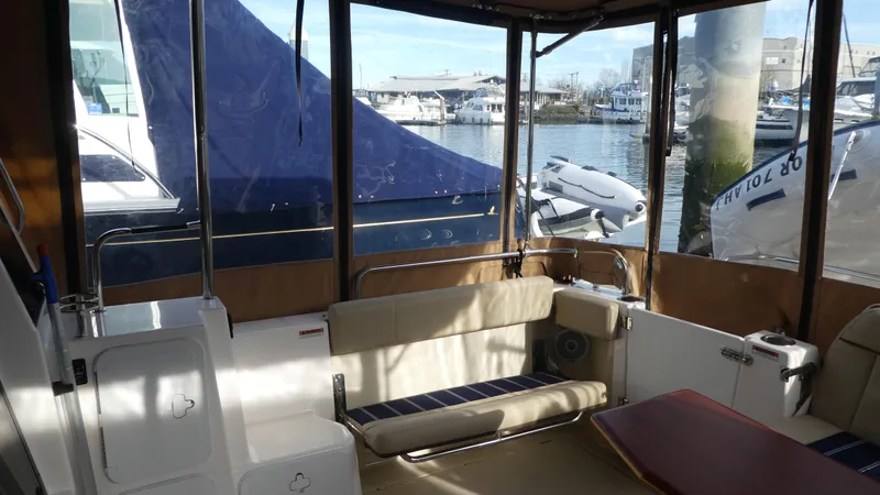 Second Act Yacht Photos Pics 2021 Ranger Tugs R-29 S interior with seating, docked at marina.