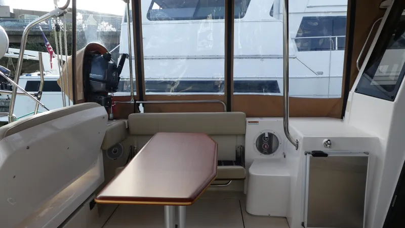 Second Act Yacht Photos Pics Interior of 2021 Ranger Tugs R-29 S with seating and table.