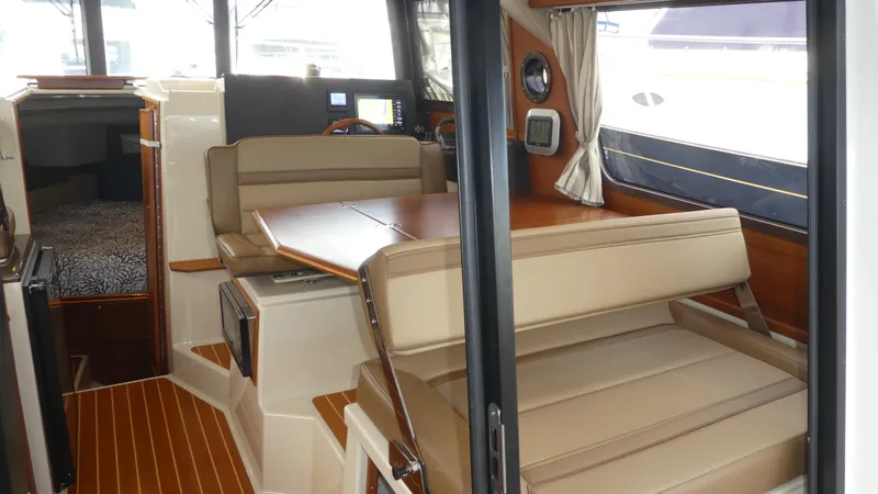 Second Act Yacht Photos Pics Interior of 2021 Ranger Tugs R-29 S with seating and dining area.