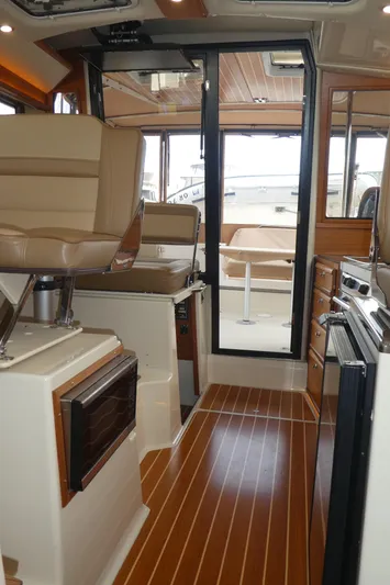 Second Act Yacht Photos Pics Interior of 2021 Ranger Tugs R-29 S with modern seating and wood flooring.