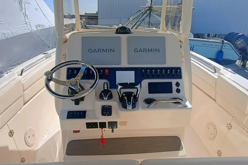 271-508 Brokerage Joe Yacht Photos Pics 2023 Grady-White Canyon 271 boat dashboard with Garmin navigation system.