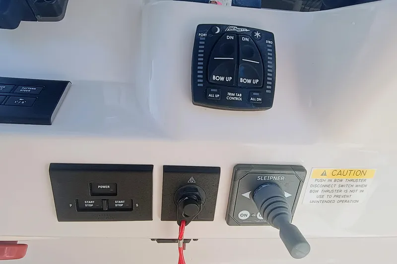 271-508 Brokerage Joe Yacht Photos Pics Control panel of 2023 Grady-White Canyon 271 boat with various switches and levers.