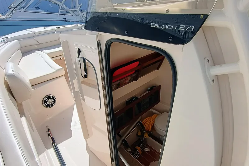 271-508 Brokerage Joe Yacht Photos Pics 2023 Grady-White Canyon 271 boat interior with storage and seating.