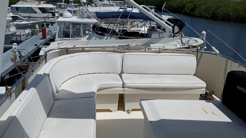 Revanche II Yacht Photos Pics 1986 Hatteras 53 Extended Deckhouse Motor Yacht with spacious outdoor seating area.