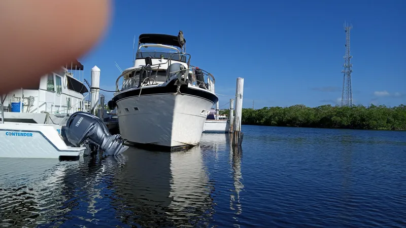 Revanche II Yacht Photos Pics 1986 Hatteras 53 Extended Deckhouse Motor Yacht docked at marina.