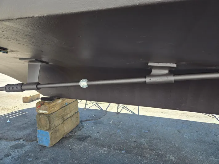 Revanche II Yacht Photos Pics 1986 Hatteras 53 Extended Deckhouse hull underside with stabilizer fin and support blocks.