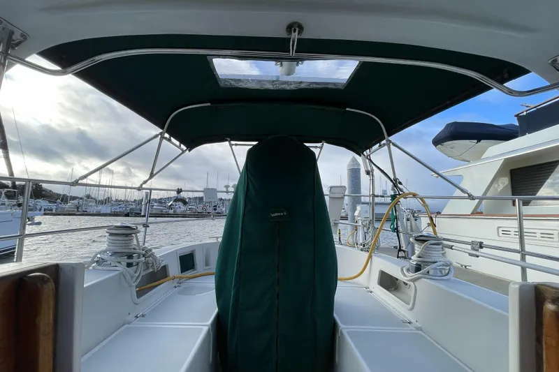 Skimmer Yacht Photos Pics Cockpit view of 2000 Valiant 42 sailboat docked in a marina.