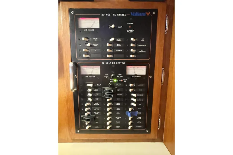 Skimmer Yacht Photos Pics Electrical panel of a 2000 Valiant 42 boat, featuring 120V AC and 12V DC systems.