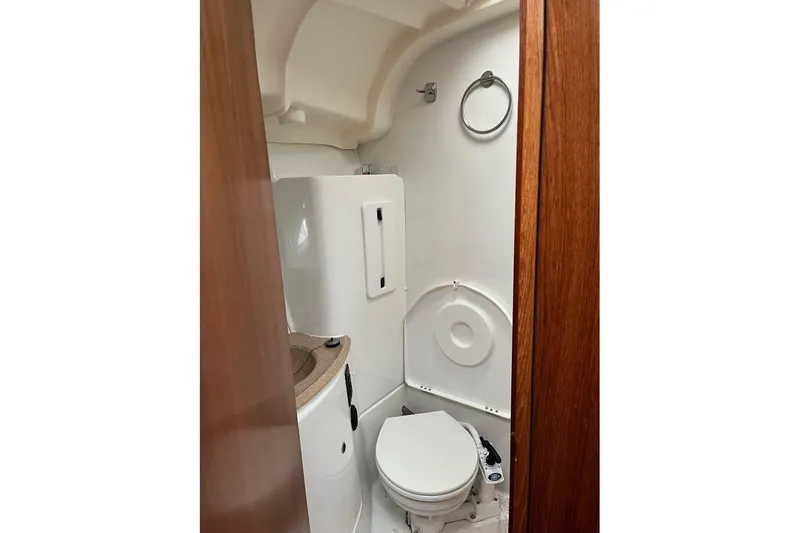 Arrow Yacht Photos Pics Bathroom interior of 2008 Jeanneau Sun Odyssey 45 yacht, featuring compact design and wooden accents.