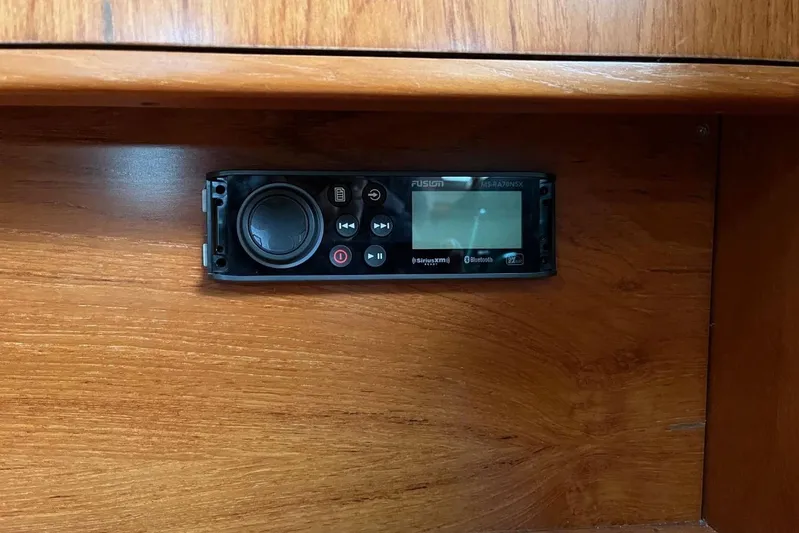 Arrow Yacht Photos Pics Audio system on 2008 Jeanneau Sun Odyssey 45 yacht, mounted on wooden panel.