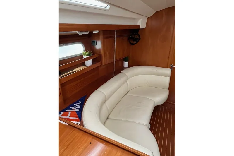 Arrow Yacht Photos Pics Luxurious interior of 2008 Jeanneau Sun Odyssey 45 yacht with cream leather seating.