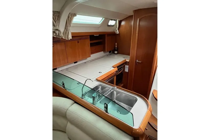 Arrow Yacht Photos Pics Interior of 2008 Jeanneau Sun Odyssey 45 yacht, featuring a modern kitchen area.