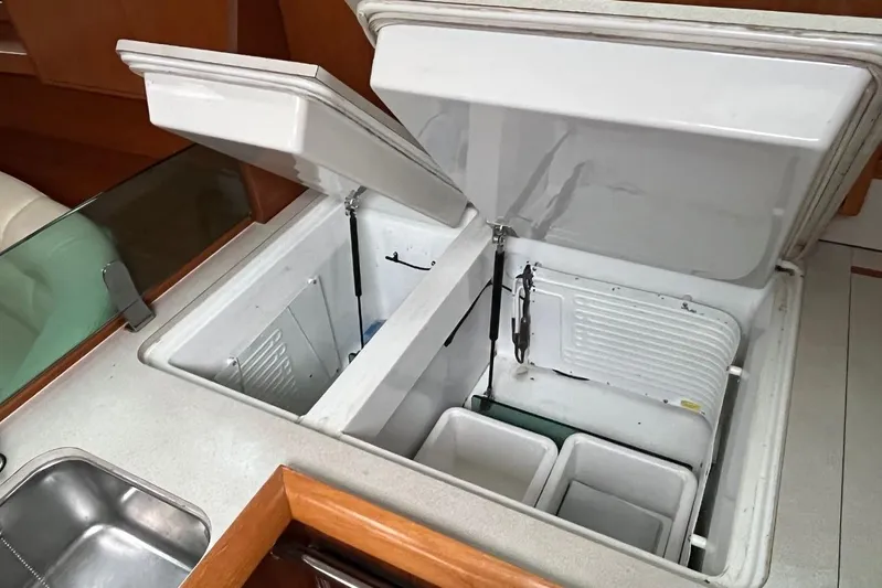 Arrow Yacht Photos Pics Open refrigerator compartments in 2008 Jeanneau Sun Odyssey 45 yacht kitchen.