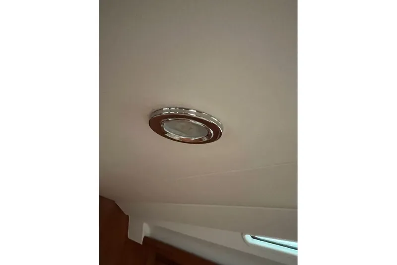 Arrow Yacht Photos Pics Ceiling light fixture inside 2008 Jeanneau Sun Odyssey 45 yacht cabin.