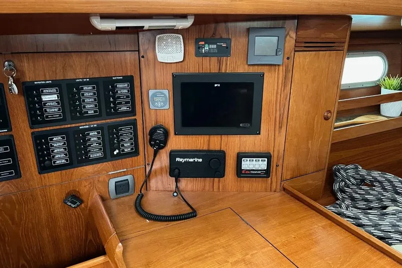 Arrow Yacht Photos Pics Control panel of a 2008 Jeanneau Sun Odyssey 45 sailboat, featuring navigation and communication equipment.