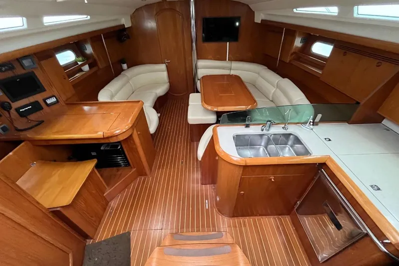 Arrow Yacht Photos Pics Interior of 2008 Jeanneau Sun Odyssey 45 yacht with wood finish and modern amenities.