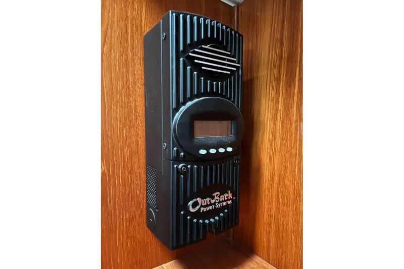 Arrow Yacht Photos Pics OutBack Power Systems device on Jeanneau Sun Odyssey 45, 2008 model, mounted on wooden panel.